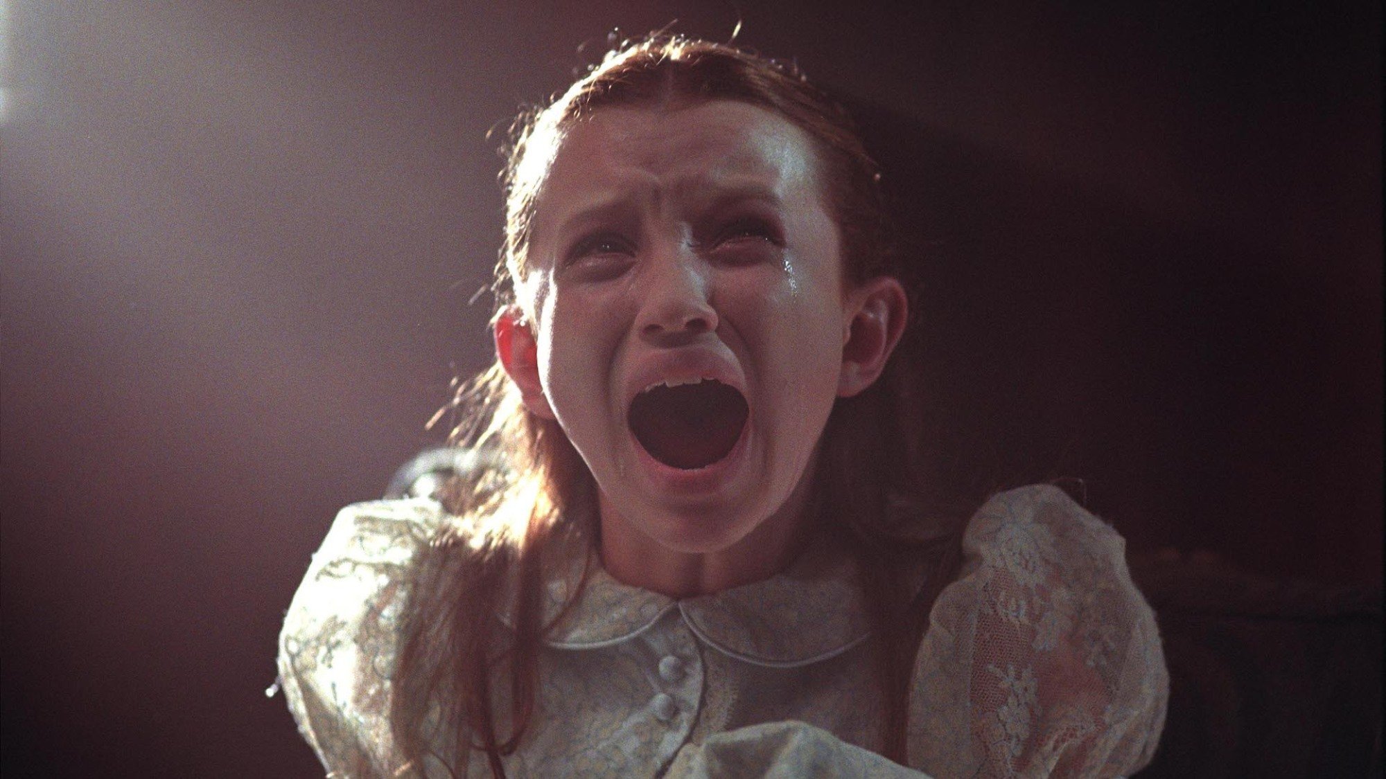 A young Emily Browning screams in the movie 