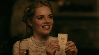 Samara Weaving as Grace holding up the 