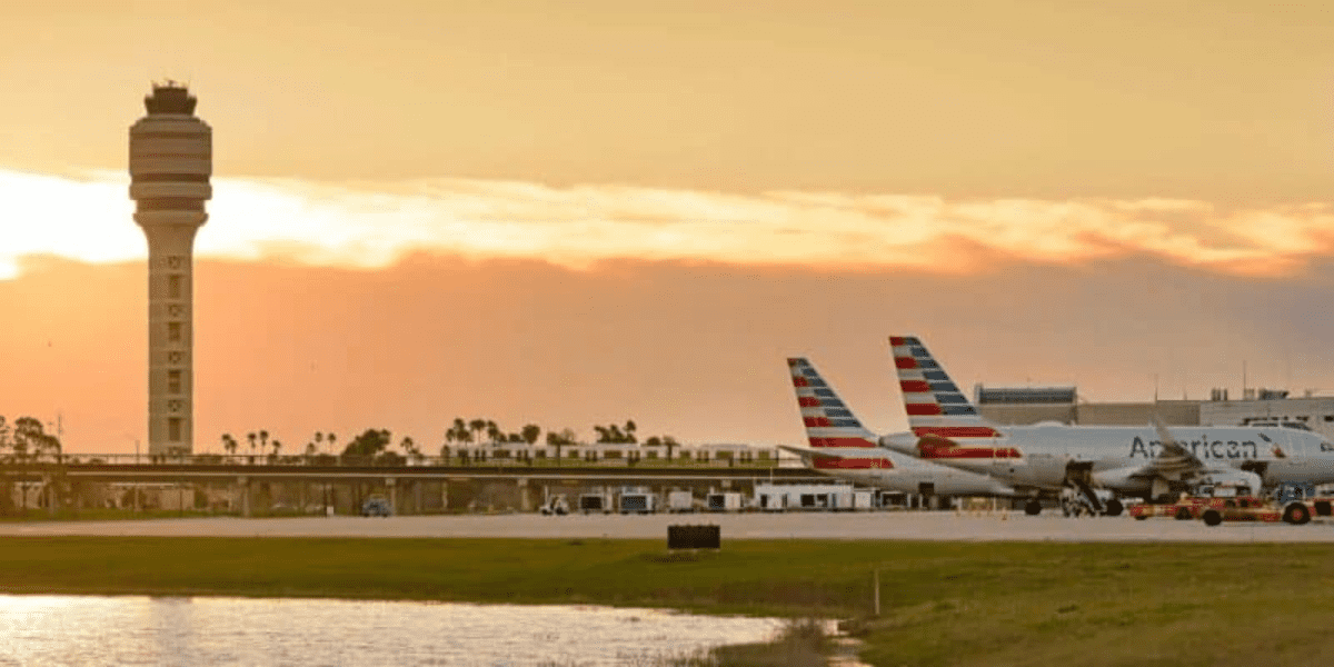 orlando international airport planes on tarmac at sunset