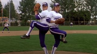 Matt Damon and Greg Kinnear as conjoined twins pitching in a baseball game in Stuck On You