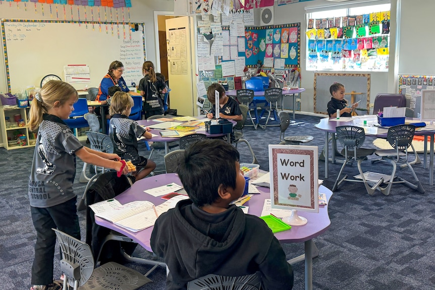 students in a classroom with a teacher