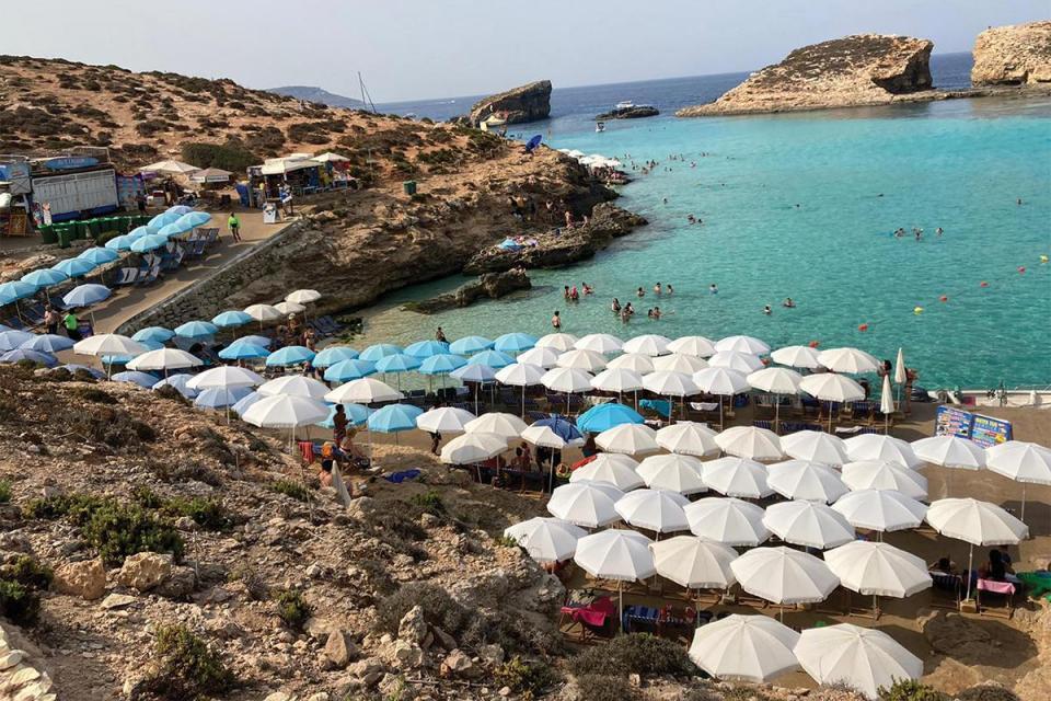 Umbrellas set up by operators hogging the available space by the water’s edge. File photo: Karl Andrew Micallef