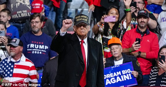 Former US President and Republican presidential candidate Donald Trump pumps his fist after speaking at the end of a campaign rally at Atrium Health Amphitheater in Macon, Georgia, on November 3, 2024. (Photo by Elijah Nouvelage / AFP) (Photo by ELIJAH NOUVELAGE/AFP via Getty Images)