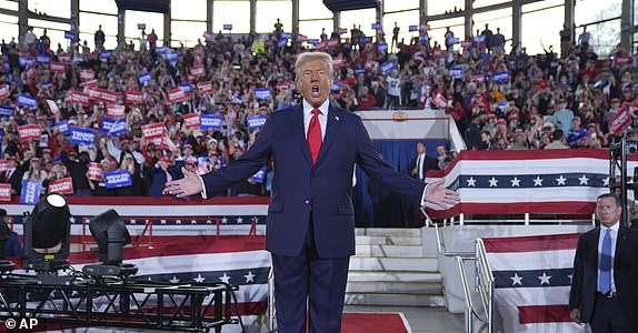 Republican presidential nominee former President Donald Trump arrives to speak at a campaign rally at J.S. Dorton Arena, Monday, Nov. 4, 2024, in Raleigh, N.C. (AP Photo/Evan Vucci)