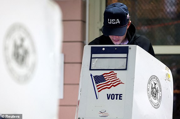 A man votes at PS 20 Anna Silver Elementary School, on Election Day for the 2024 U.S. presidential election in Manhattan, New York City, U.S., November 5, 2024. REUTERS/Andrew Kelly