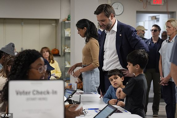 Republican vice presidential nominee Sen. JD Vance, R-Ohio, arrives to vote at the St Anthony of Padua Maronite Catholic Church on election day, Tuesday, Nov. 5, 2024, in Cincinnati. (AP Photo/Carolyn Kaster)