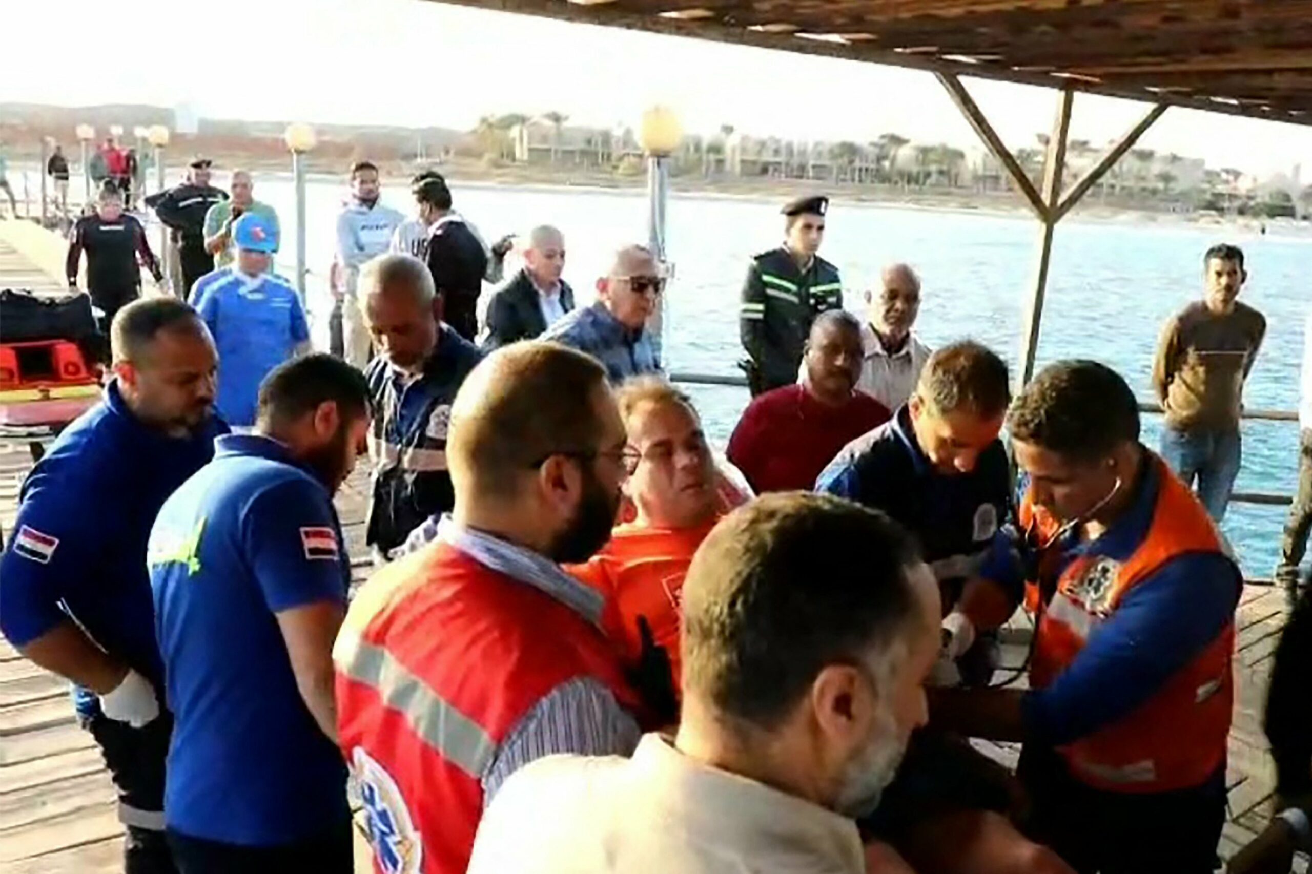 First-responders tending to a man on a stretcher after rescue from the Red Sea