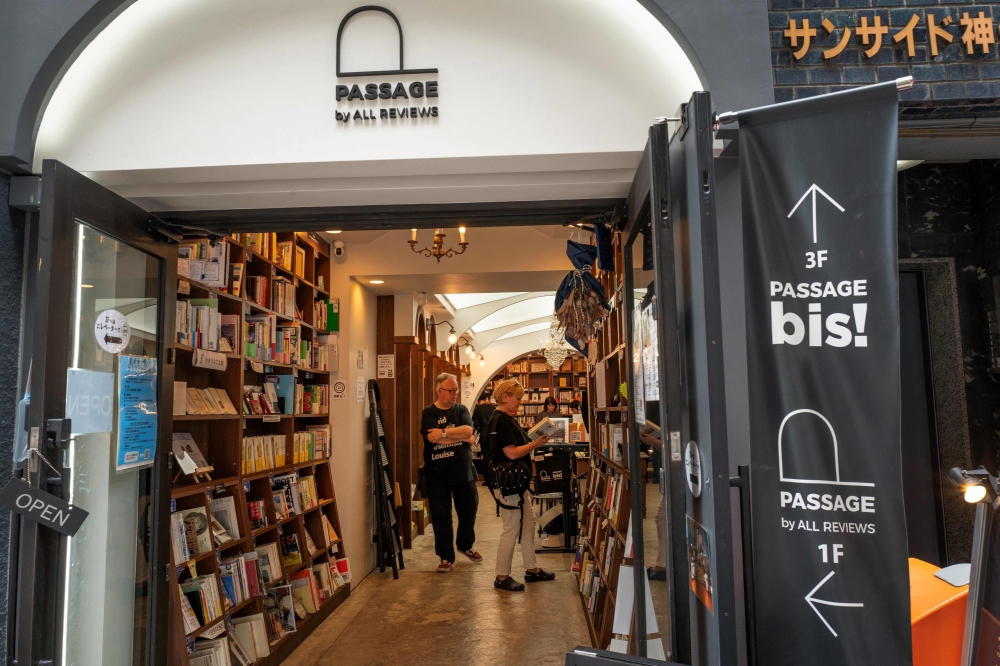 This photo taken on August 1, 2024 shows the shelf-sharing bookstore Passage operated by Rokurou Yui, president of book review site All Reviews in Tokyo’s Kanda Jimbocho district, one of the world’s largest ‘booktowns’.— AFP pic