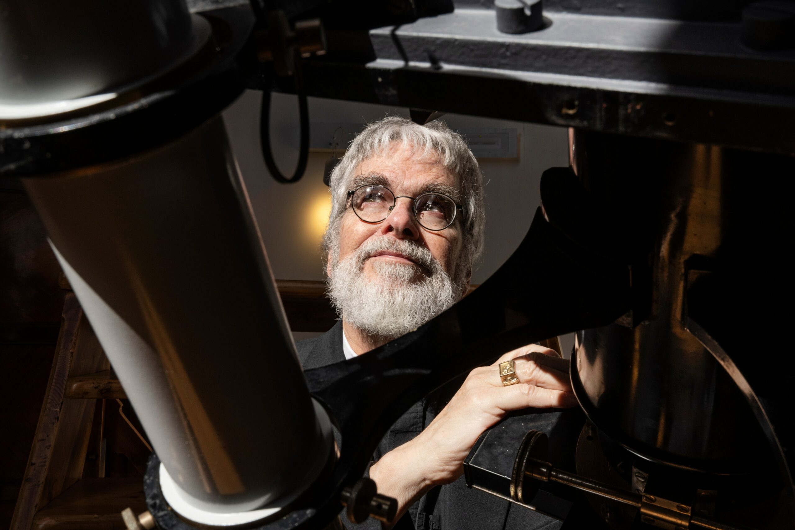 The golden ring worn by MIT graduates glints in the Italian sun as Consolmagno shows off the Vatican’s telescope