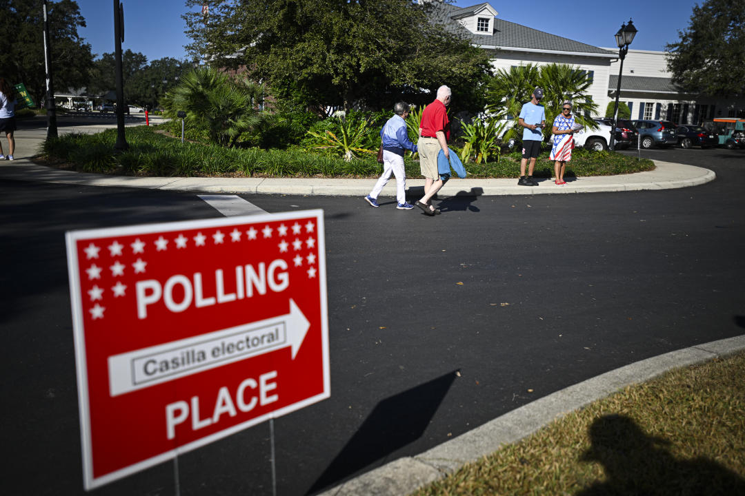 People arrive at a polling station in The Villages in Florida, on Election Day.