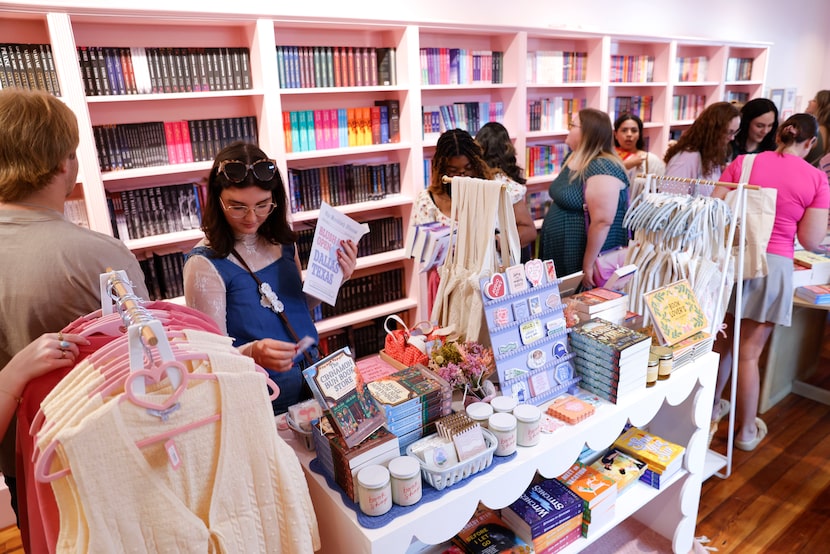 Customers shop around Blush Bookstore during the grand opening on, Saturday, Oct. 5, 2024,...