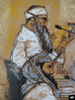 FILE - In this Jan. 21, 2009, photo of a sketch by court artist Janet Hamlin, Walid bin Attash, bottom, and Khalid Sheik Mohammad attend a hearing at the U.S. Military Commissions court for war crimes at the U.S. Naval Base in Guantanamo Bay, Cuba.