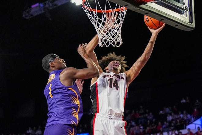 Nov 4, 2024; Athens, Georgia, USA; Georgia Bulldogs forward Asa Newell (14) shoots over Tennessee Tech Golden Eagles guard Mekhi Cameron (1) during the first half at Stegeman Coliseum. Mandatory Credit: Dale Zanine-Imagn Images