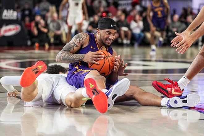 Nov 4, 2024; Athens, Georgia, USA; Tennessee Tech Golden Eagles guard Kyle Layton (2) wrestles the ball away from Georgia Bulldogs guard Dakota Leffew (1) during the first half at Stegeman Coliseum. Mandatory Credit: Dale Zanine-Imagn Images