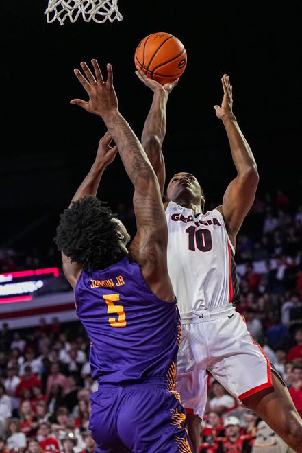 Nov 4, 2024; Athens, Georgia, USA; Georgia Bulldogs forward RJ Godfrey (10) shoots over Tennessee Tech Golden Eagles forward Rodney Johnson Jr. (5) at Stegeman Coliseum. Mandatory Credit: Dale Zanine-Imagn Images