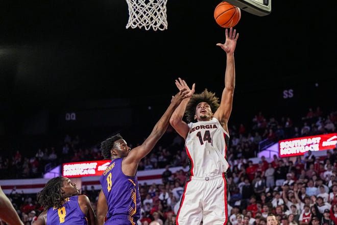 Nov 4, 2024; Athens, Georgia, USA; Georgia Bulldogs forward Asa Newell (14) shoots over Tennessee Tech Golden Eagles forward Ola Ajiboye (8) at Stegeman Coliseum. Mandatory Credit: Dale Zanine-Imagn Images