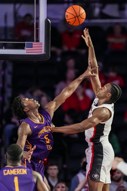 Nov 4, 2024; Athens, Georgia, USA; Georgia Bulldogs forward RJ Godfrey (10) shoots over Tennessee Tech Golden Eagles forward Rodney Johnson Jr. (5) at Stegeman Coliseum. Mandatory Credit: Dale Zanine-Imagn Images