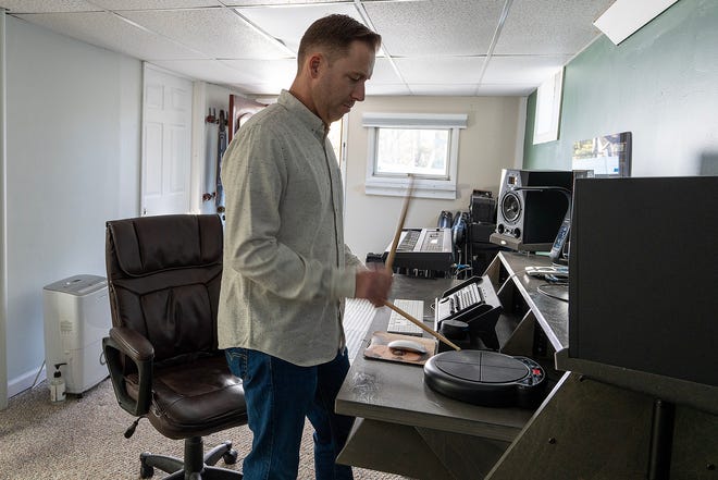 Colin Bell of Matawan, who composed the film score for the newly released holiday movie, Christmas Cowboy, plays an electric drum pad in his home studio in Matawan, NJ Friday, November 15, 2024.