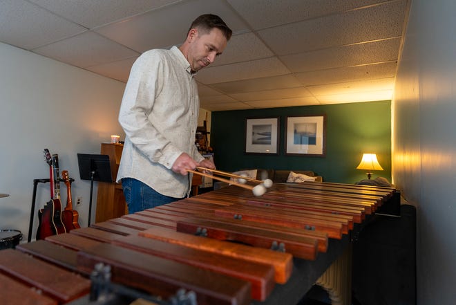 Colin Bell of Matawan, who composed the film score for the newly released holiday movie, Christmas Cowboy, plays the marimba in his home studio in Matawan, NJ Friday, November 15, 2024.