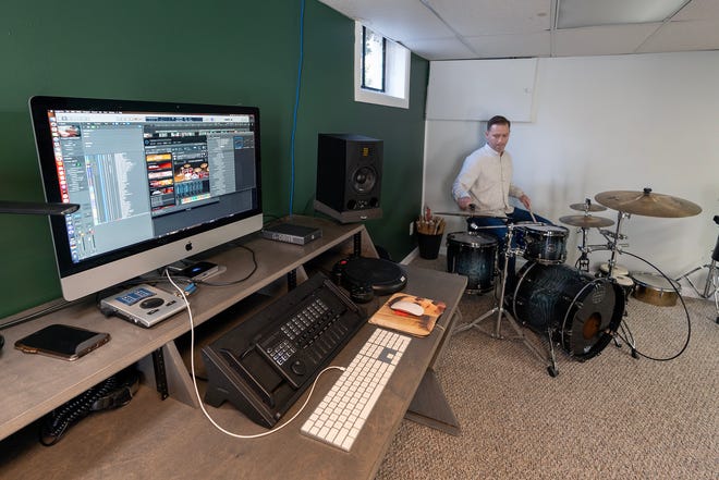 Colin Bell of Matawan, who composed the film score for the newly released holiday movie Christmas Cowboy, plays the drums in his home studio in Matawan, NJ Friday, November 15, 2024.