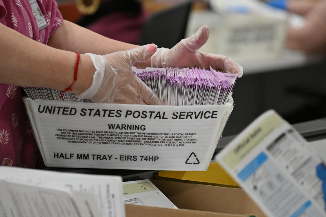 TOPSHOT - Election workers prepare mail-in ballots for tallying at the Los Angeles County Ballot Processing Center on the eve of Election Day, November 4, 2024, in City of Industry, California. (Photo by Robyn Beck / AFP) (Photo by ROBYN BECK/AFP via Getty Images)