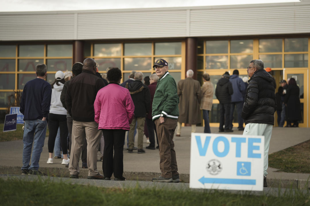 Voters wait in line to cast their ballots at Scranton High School in Scranton, Pa., on Election Day, Tuesday, Nov. 5, 2024. (AP Photo/Matt Rourke)