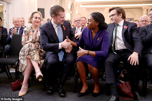 The leadership rivals shake hands after the announcement of the result today