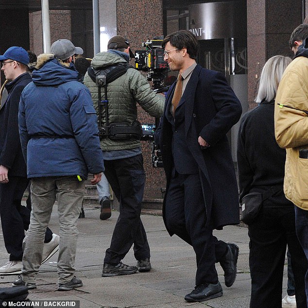 Glen was seen surrounded by crew members as filming for the exciting movie continued, three years after a remake was announced