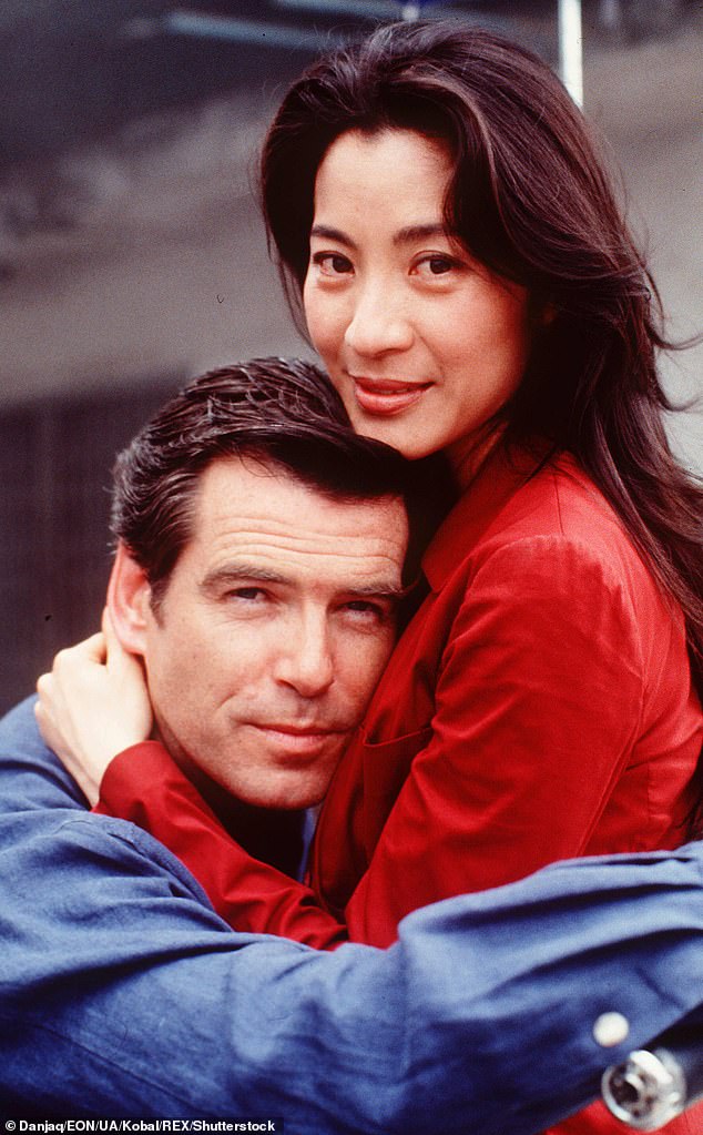 At the time of the release of Tomorrow Never Dies, the Bond franchise was making a determined effort to appeal to female audiences and to shake off its sexist image. Pictured: Brosnan and Yeoh in a scene from the film