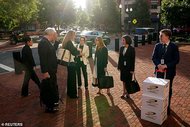 Google legal team members wait outside the courthouse