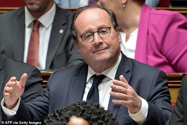 Left-leaning French MP and former President Francois Hollande gestures as he attends a session of questions to the government at The National Assembly in Paris on November 26, 2024