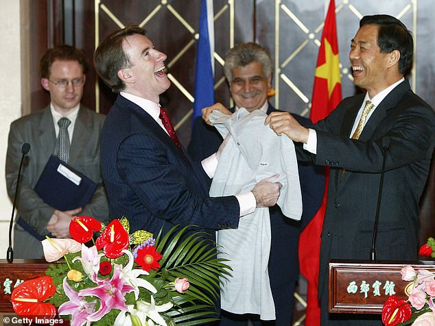 Peter Mandelson (left) receives a Chinese-made T-shirt from Chinese Commerce Minister Bo Xilai at a press conference in 2005