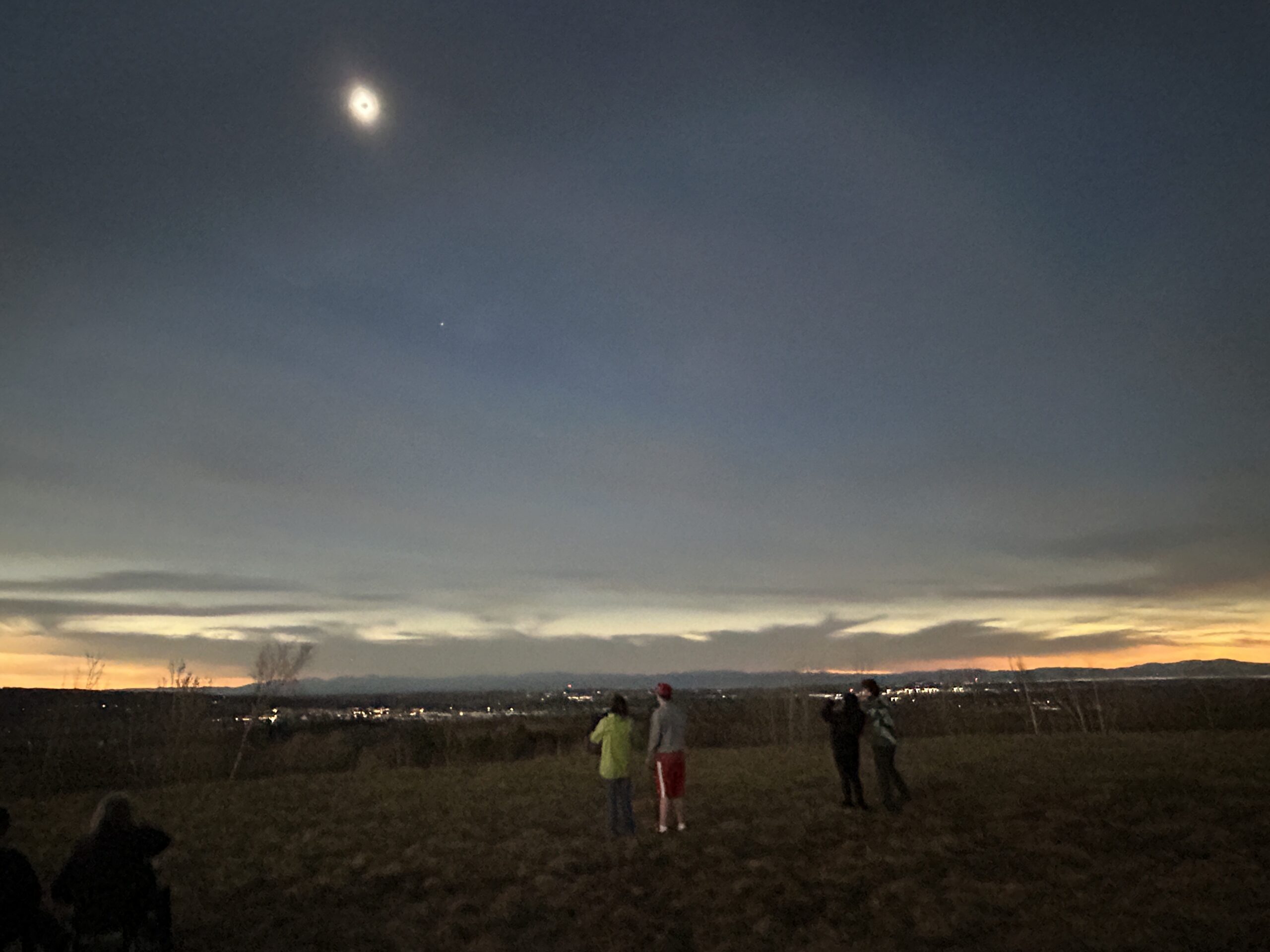 Eclipse watchers in Williston, overlooking Burlington, Lake Champlain and the Adirondacks. VermontBiz photo.