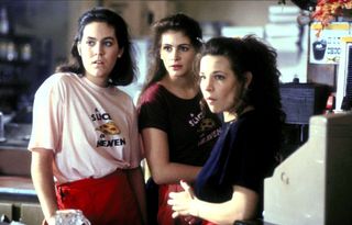 three teenage girls around the counter at a pizza shop in mystic pizza