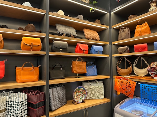 Shelves of colorful leather handbags