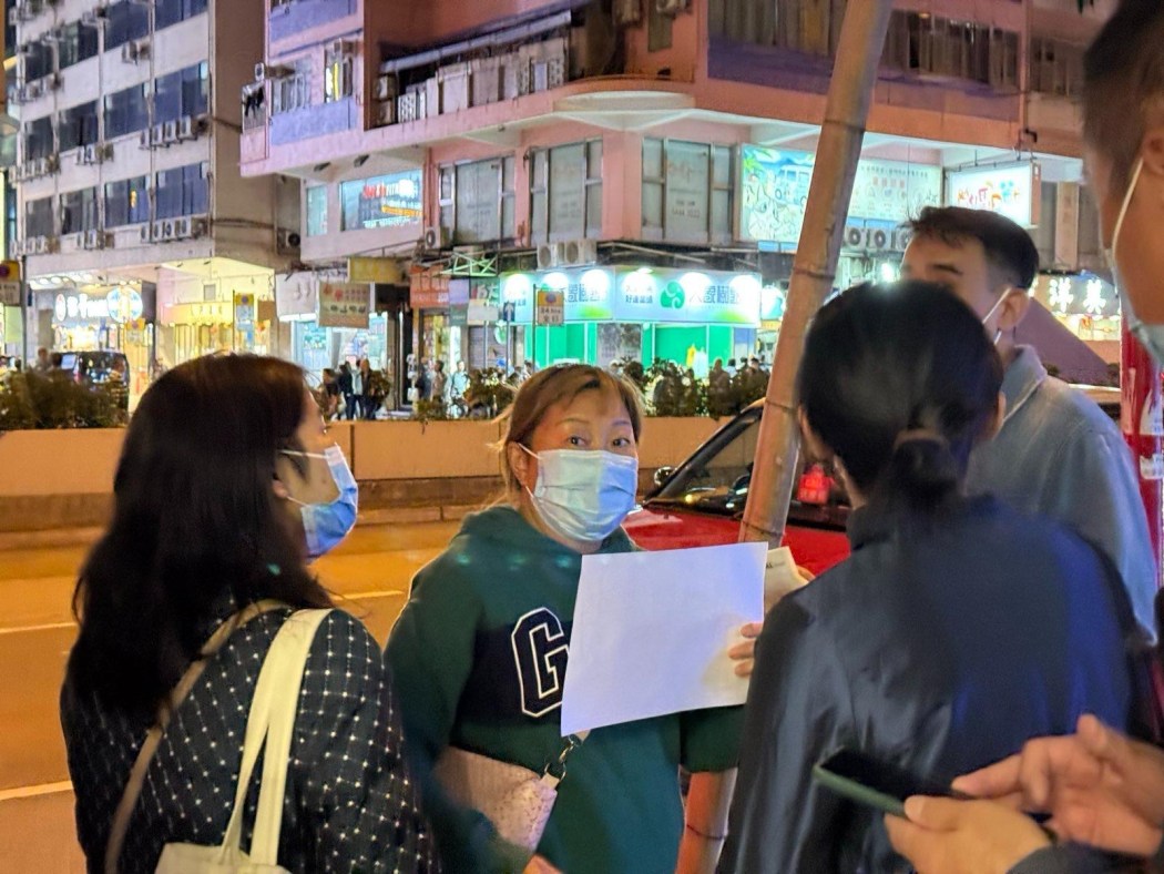 A group of people protest outside of the independent bookshop Talentum on the evening of November 27, 2024 when the travel writer hosts a book launch event. Photo: Pazu.  