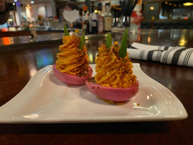 Cheers Pickled Deviled Eggs -- prepared using beet-juice pickled egg whites and a filling of whipped sundried tomato and egg yolk with spices -- stands ready for a Cheers Chico customer on Monday, Nov. 11, 2024 in Chico, California. (Kyra Gottesman/Mercury-Register)