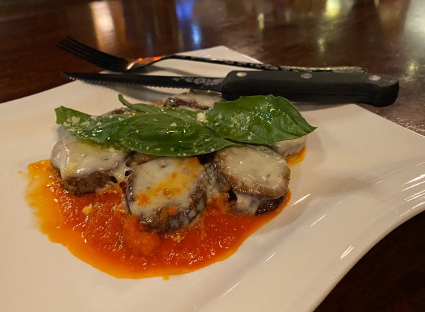 A Cheers Chico Mini Eggplant Parmigiana appetizer featuring a fresh tomato marinara sauce is ready to serve on Monday, Nov. 11, 2024 in Chico, California. (Kyra Gottesman/Mercury-Register)