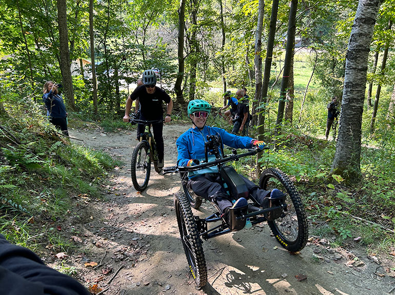 Photo: Kelly Brush, in front, and Greg Durso ride their hand-pedal, electric-assist bikes at the Driving Range in Bolton. Courtesy photo.