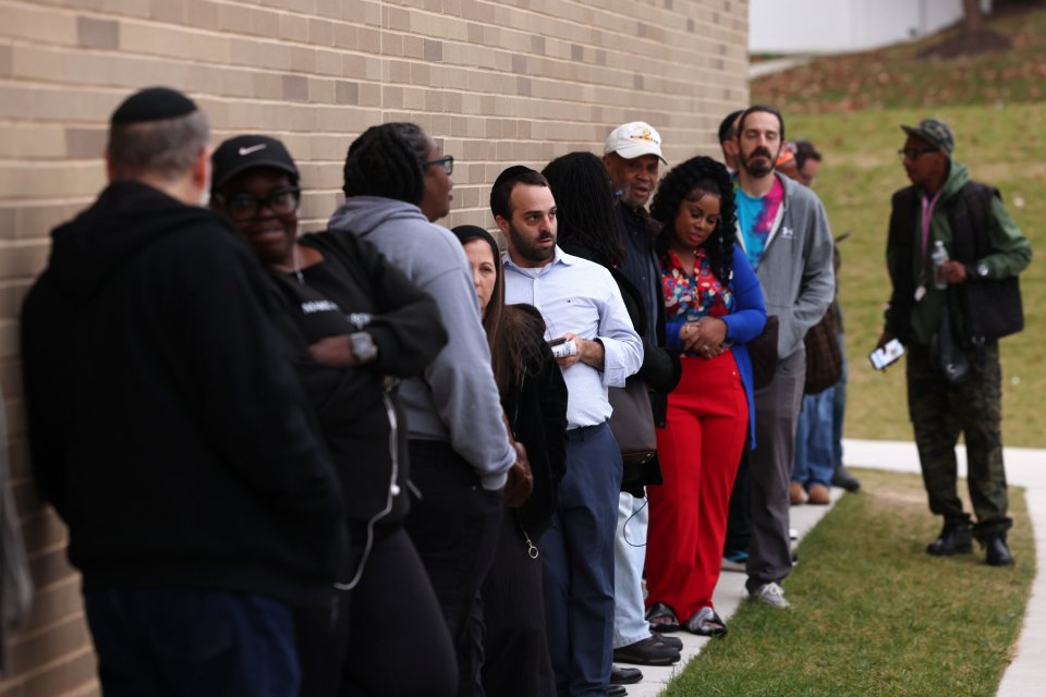 Voters line up at Cross Country Elementary School in Baltimore, Maryland, on Tuesday morning