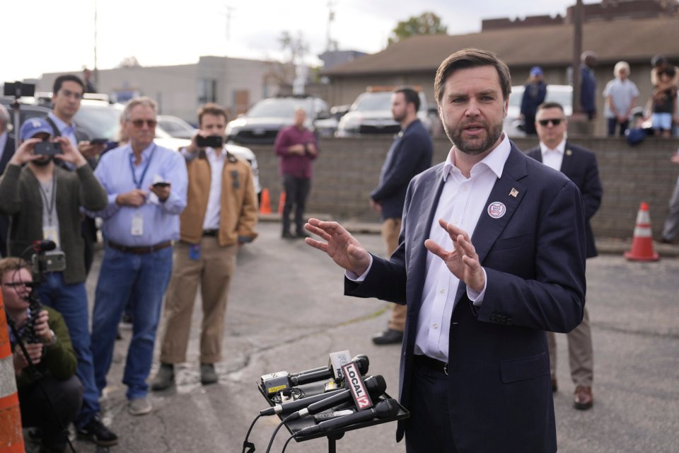 Republican vice presidential nominee JD Vance speaks to reporters after casting his vote at the St Anthony of Padua Maronite Catholic Church in Cincinnati, Ohio