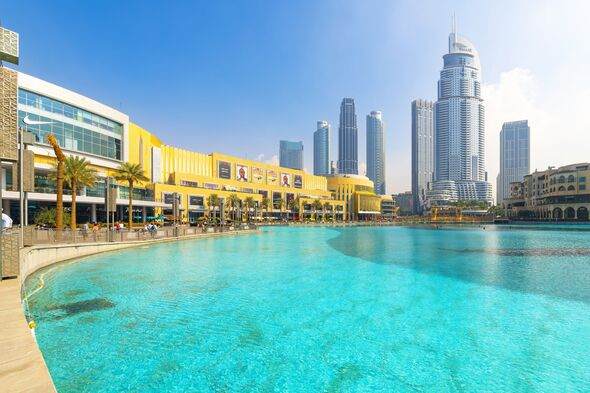 View of the Dubai Fountain and Dubai mall in Dubai, United Arab Emirates. Downtown Dubai is the city’s busy tourism hub, home to the towering Burj Kha