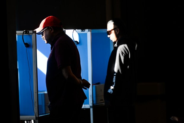 Voters are seen Tuesday, Nov. 5, 2024, in booths set up inside the Corona Public Library on Election Day. (Photo by Anjali Sharif-Paul, The Sun/SCNG)