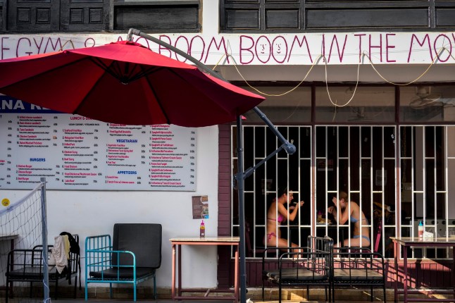 Tourists eat food at Nana Backpack hostel in Vang Vieng, Laos, Tuesday, Nov. 19, 2024. (AP Photo/Anupam Nath) 14104291 14126689