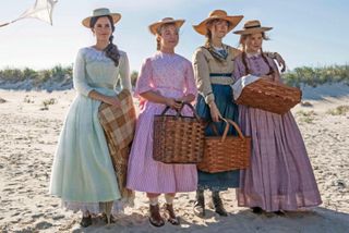 the march sisters stand on the beach smiling in Little women