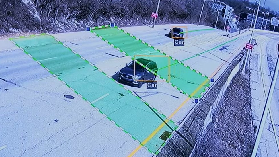 Camera monitors a highway to detect if a vehicle is going in the wrong direction on the roadway.