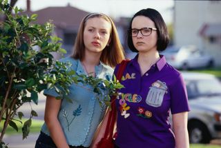 enid and rebecca hide behind a bush in ghost world