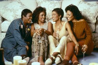 the women in the cast of Waiting to exhale sitting together and smliing