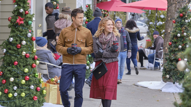 Emily and Jamie walking down street in An Unexpected Christmas