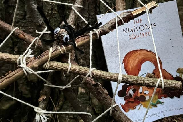 Sticks and a pine cone to create this creepy spider web from the book.